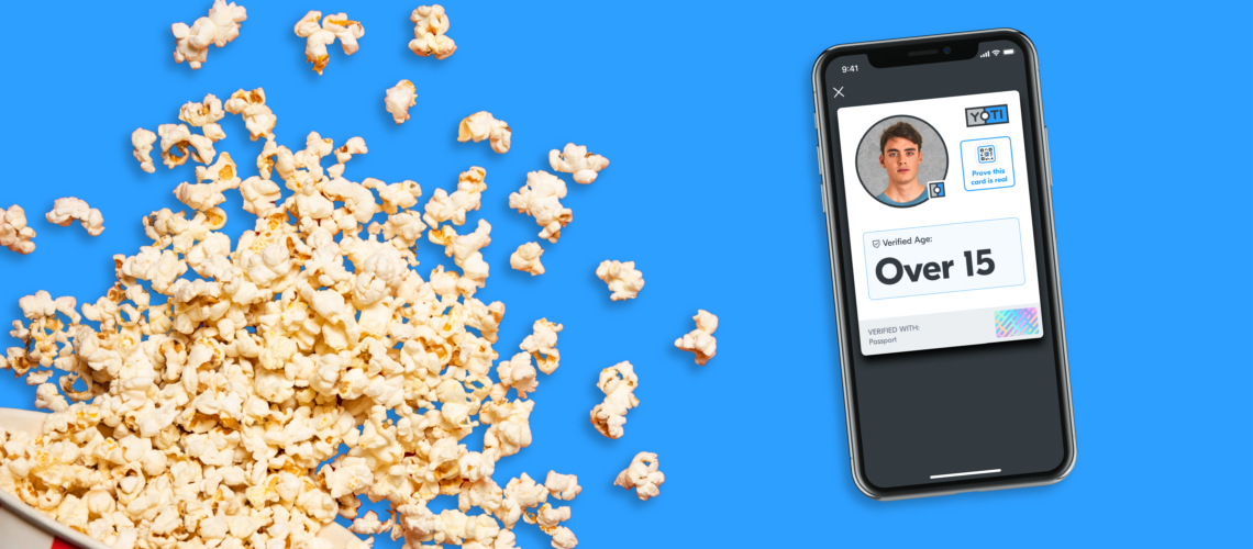 a bucket of spilt pop corn and a smart phone with a screen showing the app and the words 